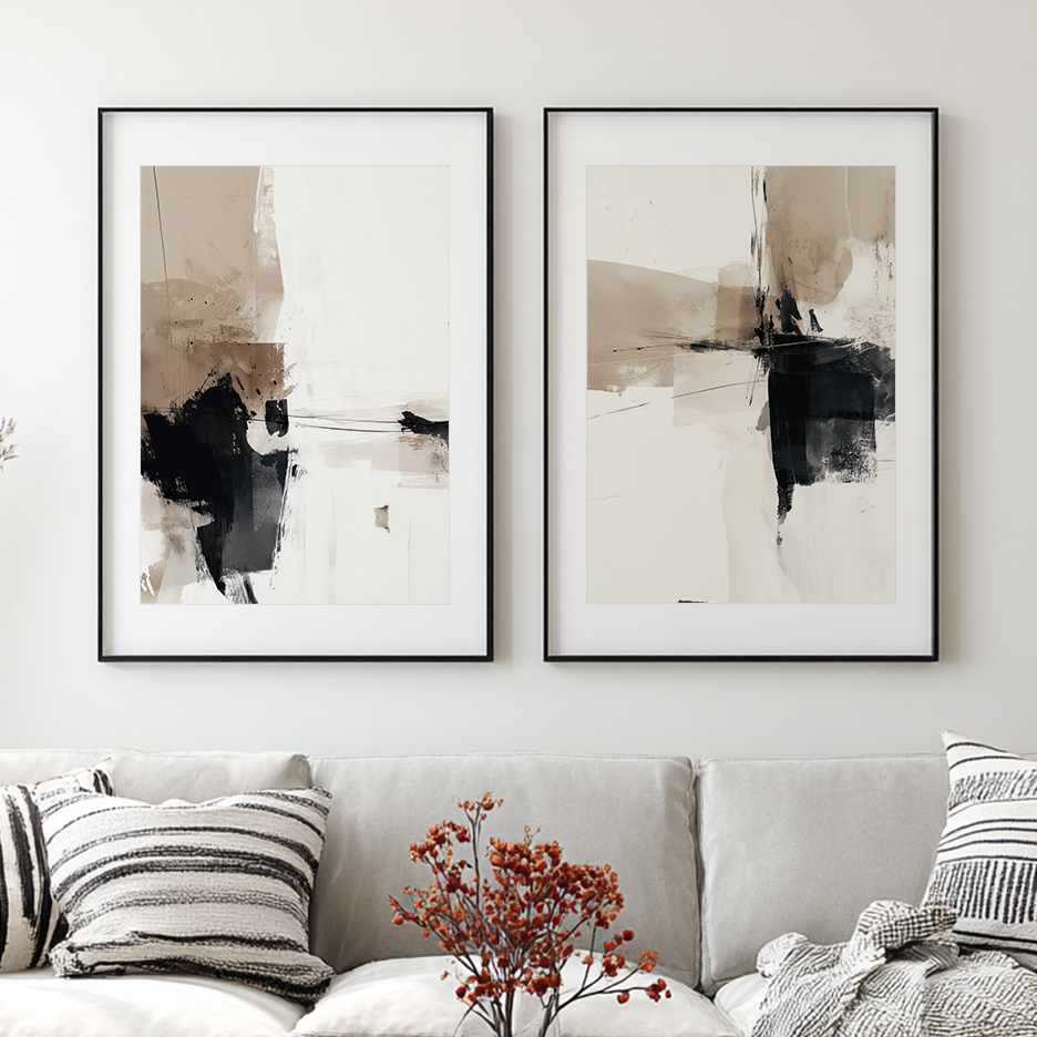 Neutral Abstract Wall Art Set of 2 | Black & Beige Prints in black frames above a neutral sofa with bold black beige and white abstract compositions