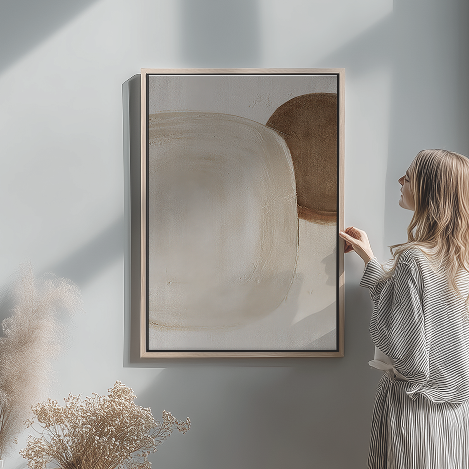 Wabi-Sabi Neutral Wall Art Set of 2 | Abstract Canvas featuring neutral abstract wall art for living room in soft beige and brown tones beside a woman