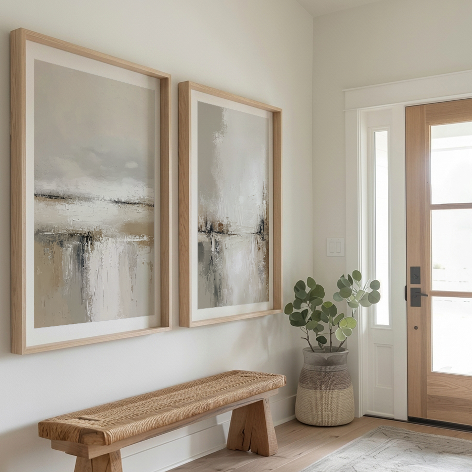 Neutral Landscape Wall Art Set of 2 | Minimalist Abstract displayed as two neutral abstract art prints in light wood frames above an entryway bench beside a plant