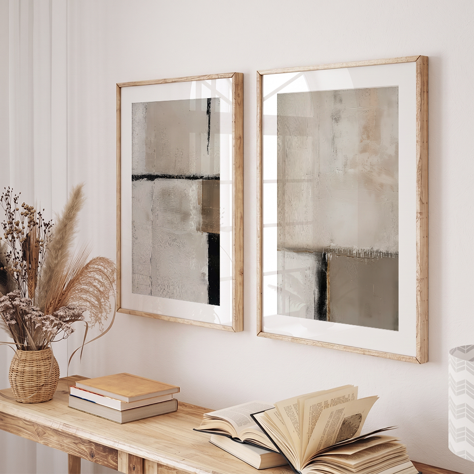 Neutral Abstract Wall Art Set of 2 | Mid-Century Modern featuring neutral abstract art prints in light wood frames above a console table with books and dried flowers.