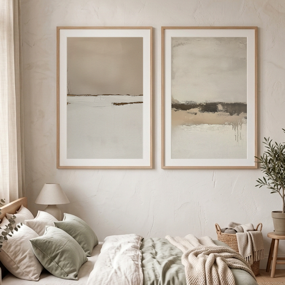 Neutral Abstract Wall Art Set | Beige Minimalist Prints featuring two beige and gray abstract prints in wood frames above a cozy neutral bedroom with bedding and woven blanket