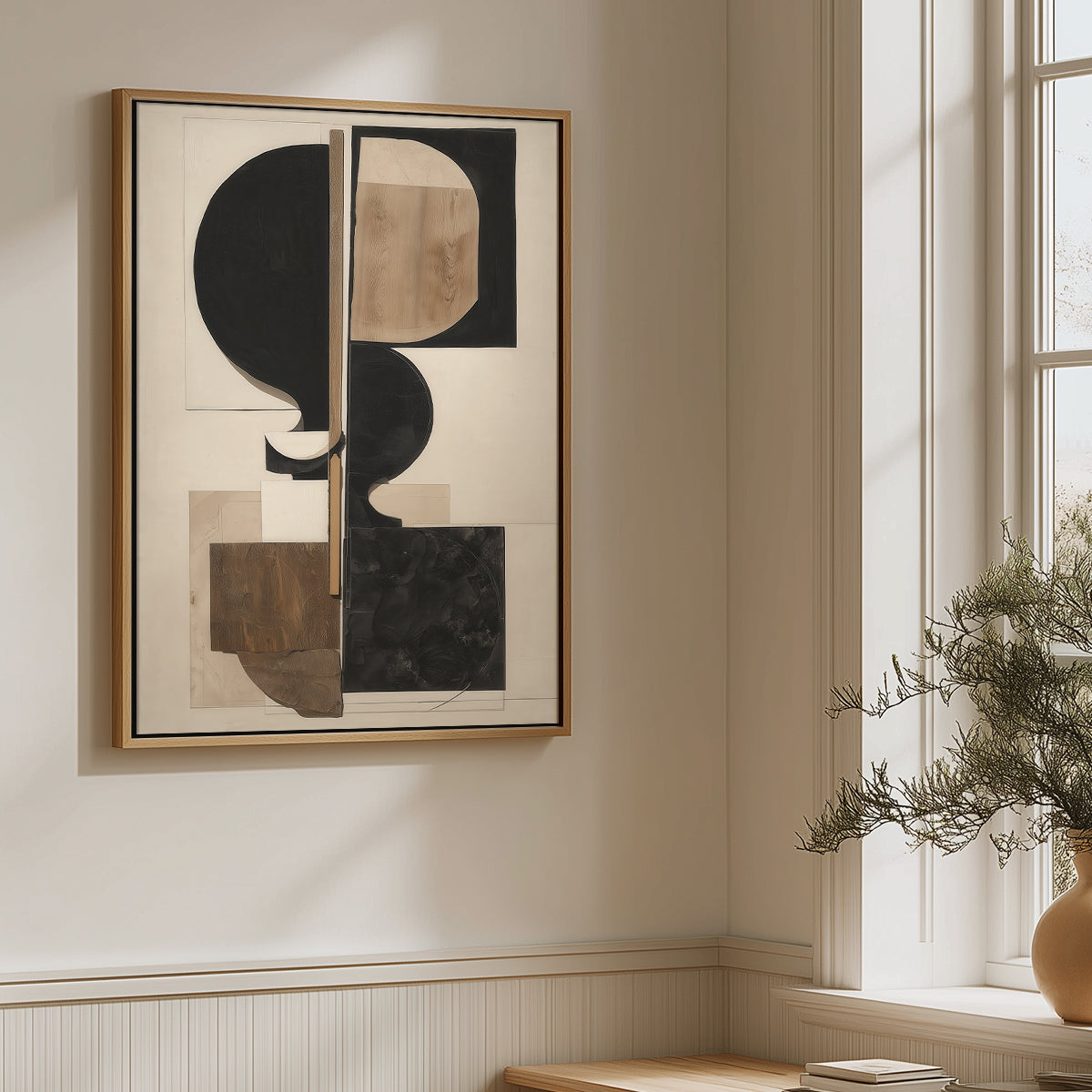 Abstract art piece on a wall in a room with a window and plant