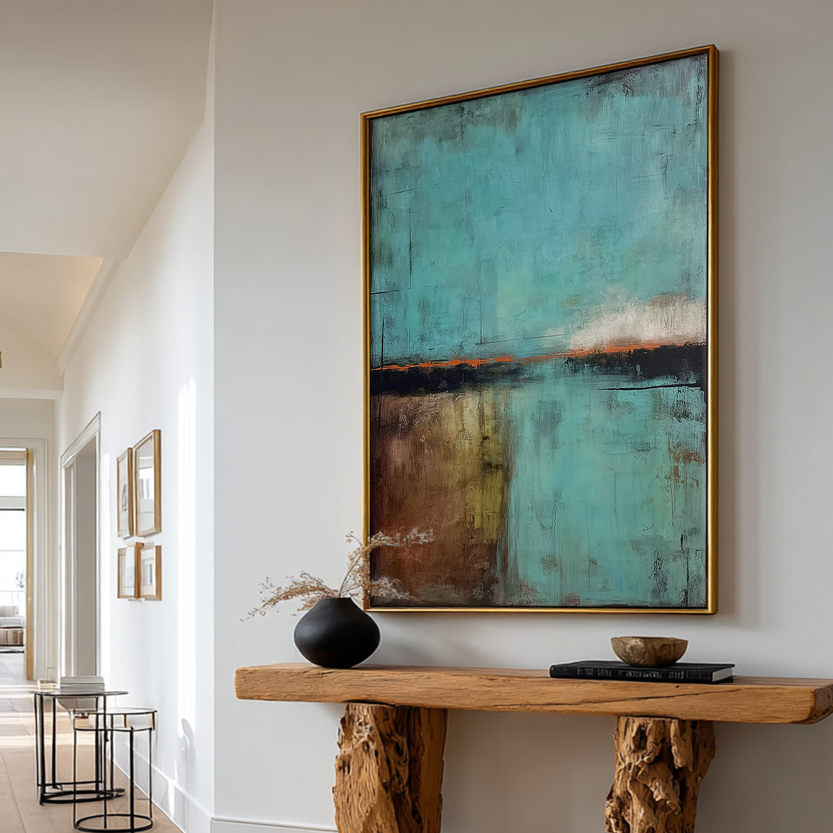 Abstract Landscape Wall Art | Modern Textured Canvas Print | Contemporary Neutral Decor featuring an abstract minimalist design with teal, brown, and black tones above a natural wood console table in a bright hallway.