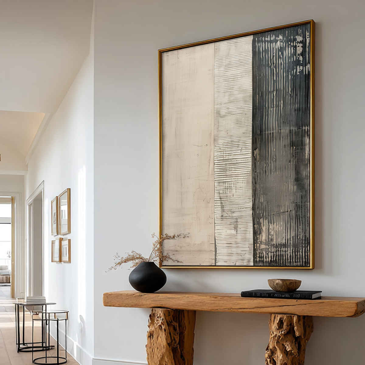 Neutral Abstract Wall Art | Minimalist Triptych Canvas featuring textured cream and charcoal panels above a rustic wood console in a bright modern hallway