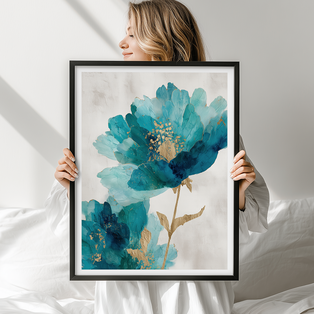 Woman holding Blue Infusion Abstract Floral Wall Art | Teal & Indigo Botanical Canvas | Modern Luxe Decor featuring vibrant teal and indigo floral abstract art with gold accents in a black frame.
