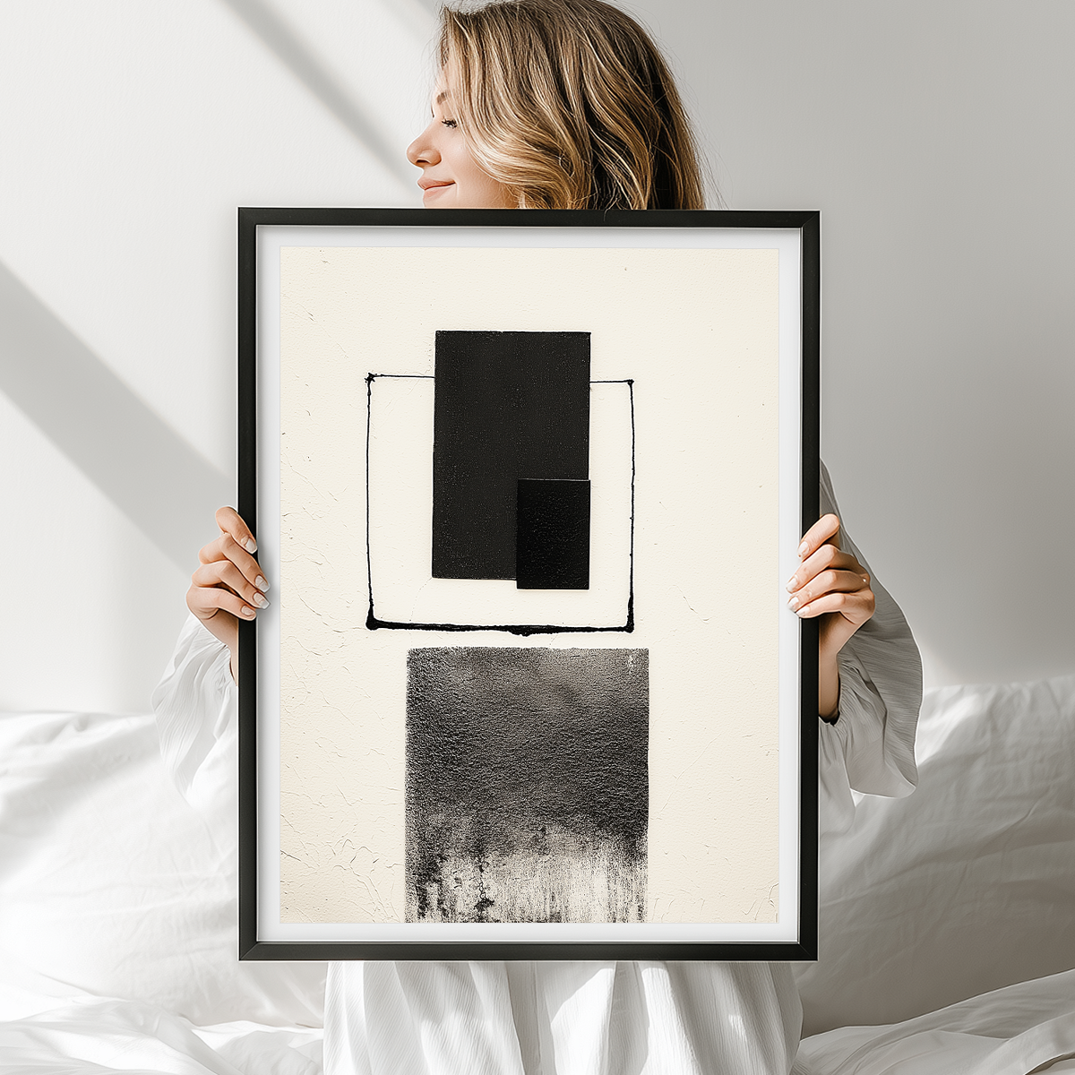 Woman holding Abstract Geometric Wall Art Print – Modern Minimalist Black & White Textured Decor featuring black textured rectangles and lines on a white background with a minimalist aesthetic.