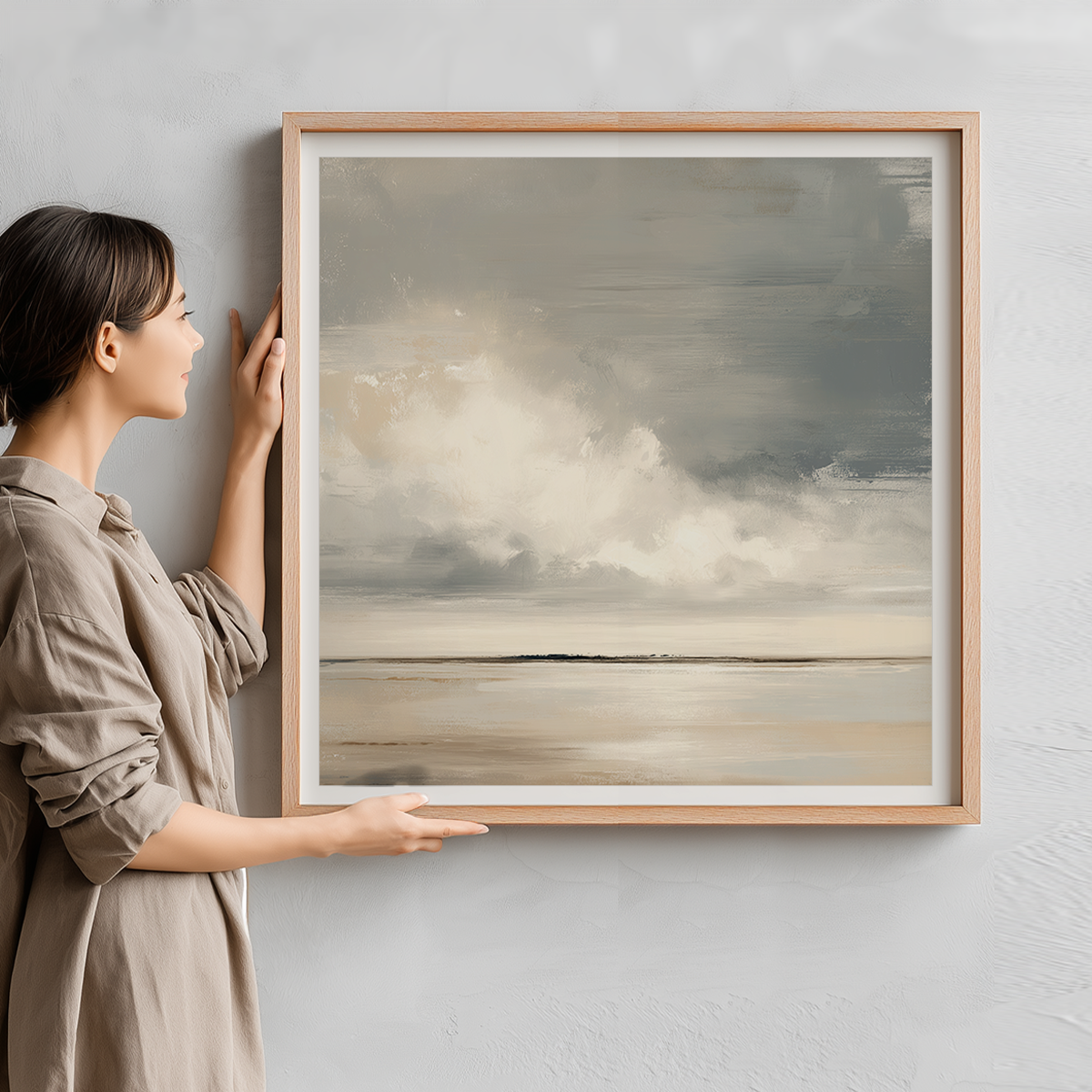 Woman holding Neutral Serene Horizon Abstract Canvas Print - Modern Minimalist Decor featuring soft neutral tones and a tranquil horizon in a modern minimalist style.
