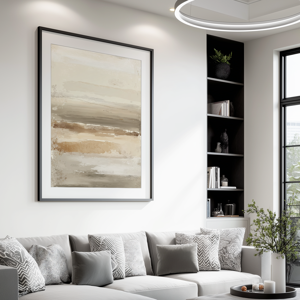 Modern living room featuring Neutral Abstract Wall Art Canvas | Beige Taupe Textured Horizon Art | Japandi Modern Decor above a light gray sofa with patterned cushions and a black shelving unit.