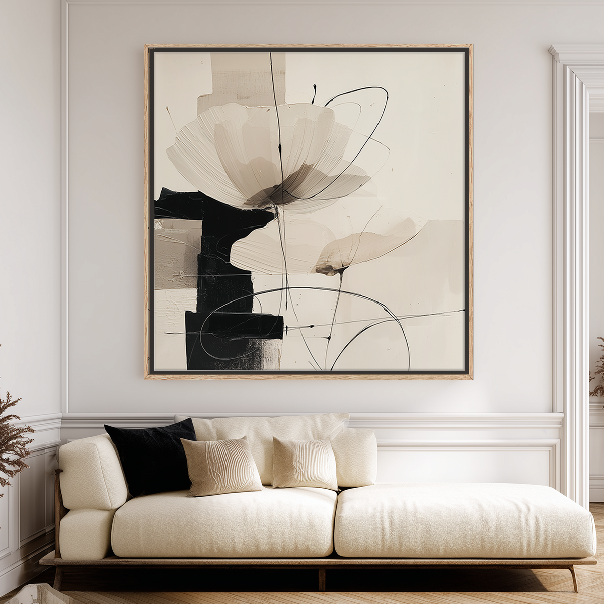 Neutral Abstract Botanical Wall Art Print - Modern Geometric Minimalist Decor featuring soft beige and black tones with abstract floral shapes above a cream sofa with neutral pillows in a contemporary living room.