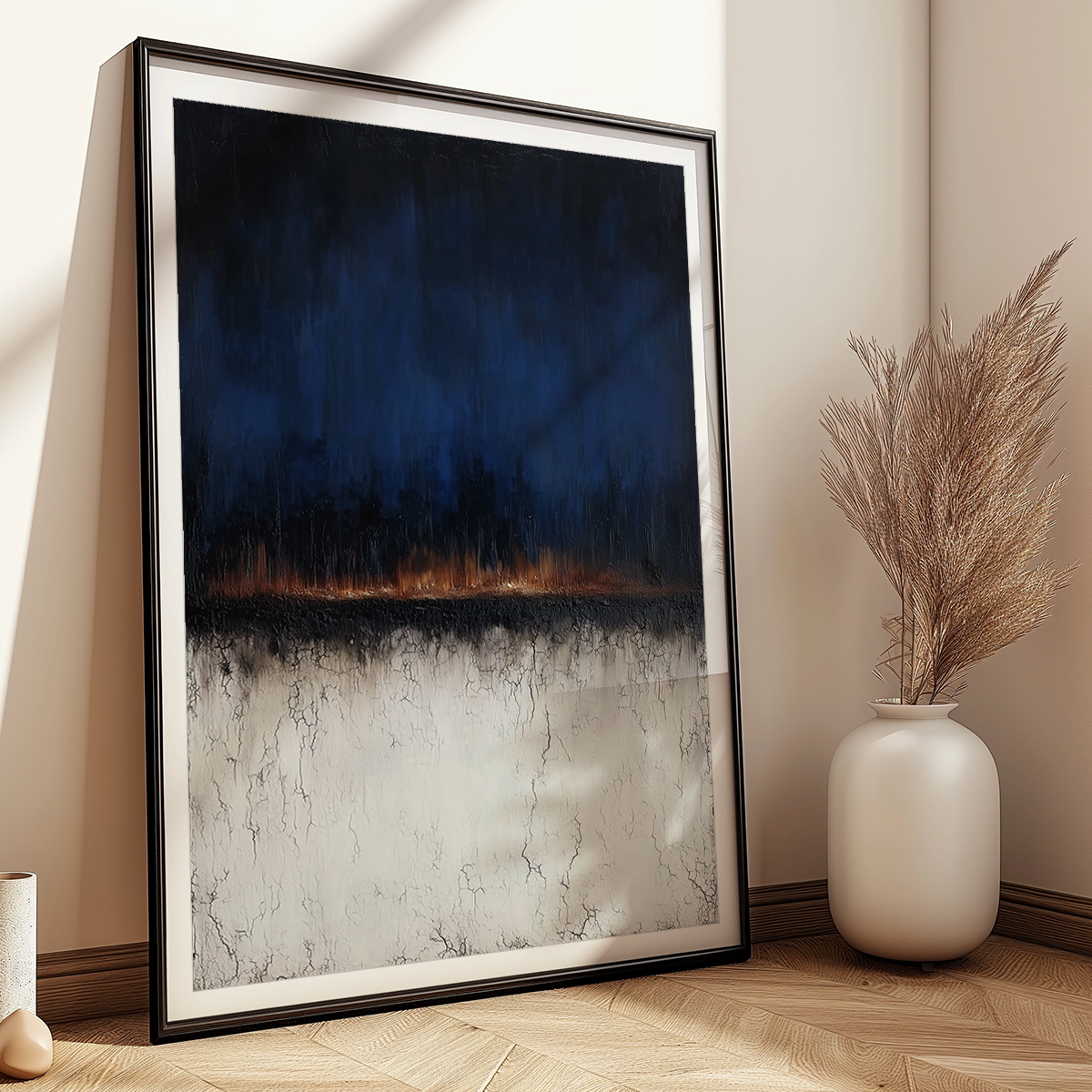 Moody Horizon Abstract Wall Art | Dark Minimalist Landscape Print | Navy & Burnt Orange Decor featuring bold navy and burnt orange tones with textured abstract design leaning against a wall near a beige vase with pampas grass.