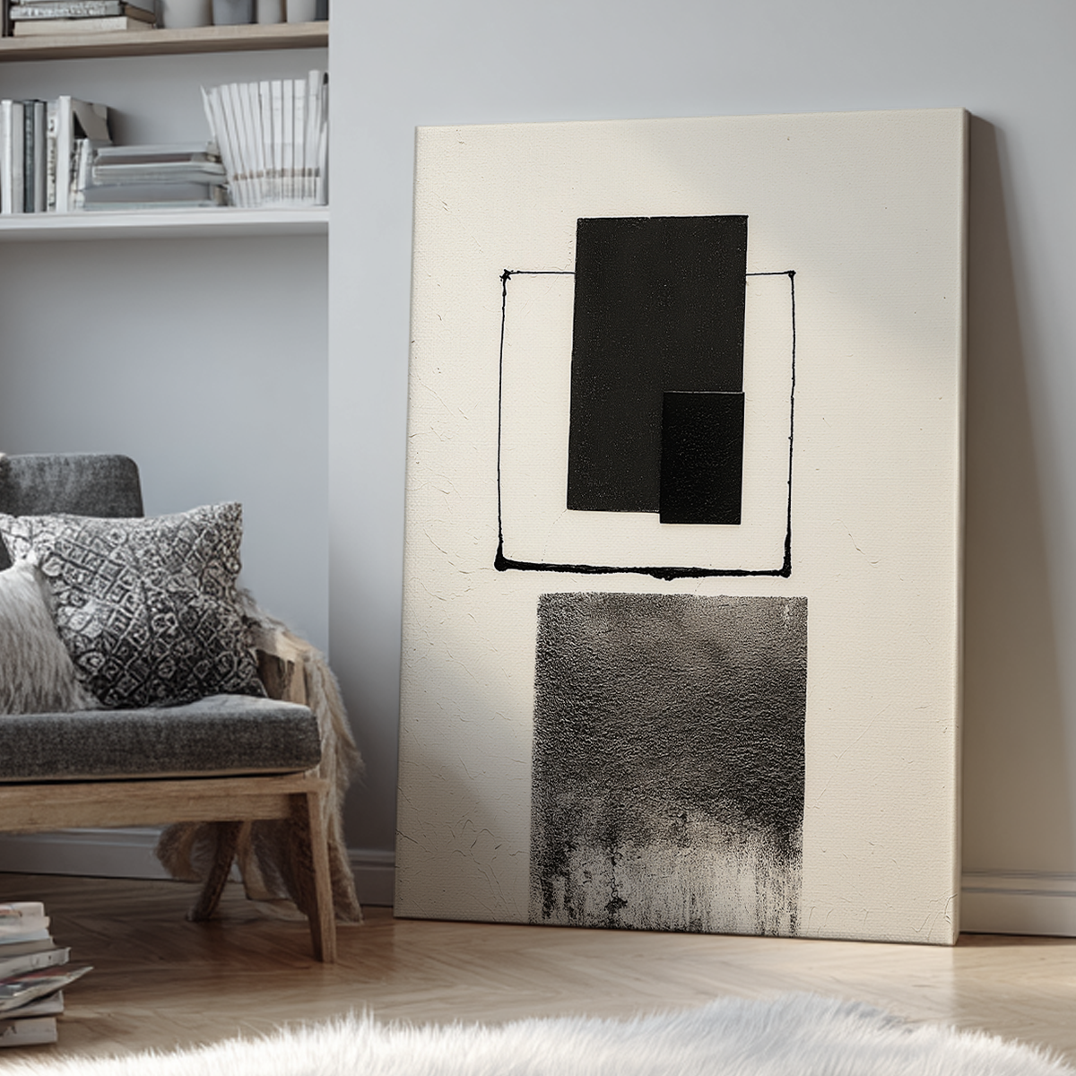 Abstract Geometric Wall Art Print – Modern Minimalist Black & White Textured Decor leaning against a wall in a cozy living room with neutral tones and a patterned cushion on a gray chair.